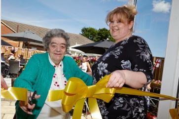 Residents celebrate new patio with garden party